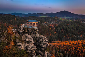 Jetrichovice, Czech Republic - Aerial view of Mariina Vyhlidka (Mary's view) lookout with a beautiful Czech autumn landscape and colorful sunset sky in Bohemian Switzerland region