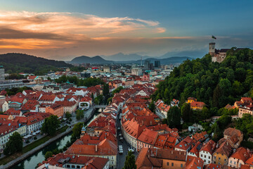 Ljubljana, Slovenia - Aerial view of Ljubljana on a summer afternoon with Franciscan Church of the Annunciation, Ljubljana Castle, Ljubljana Cathedral and skyline of capital of Slovenia at sunset