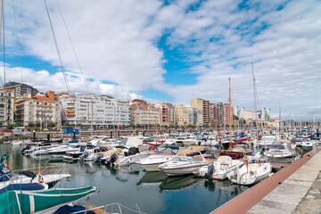 Santander, SPAIN - August 21 2022: Beautiful marina of Santander. Boats, yachts docked in the port....