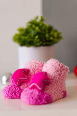 Cute pink soft fabric baby shoes, baby gender reveal.