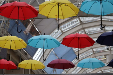 Fototapeta na wymiar Colorful umbrella rainbow art installation