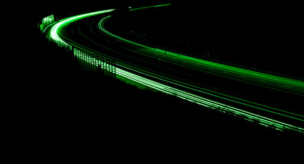 green car lights at night. long exposure