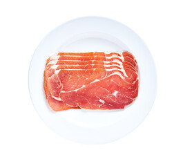 Slices of parma ham prosciutto in a plate isolated on white background.