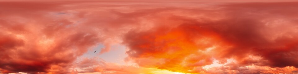 Dramatic sunset sky panorama with bright glowing red pink Cumulus clouds. HDR 360 seamless spherical panorama. Sky dome in 3D, sky replacement for aerial drone panoramas. Weather and climate change.