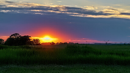 Sunset over farmland, Spring, Montague, Michigan