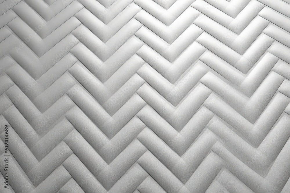 Poster a close up view of a white wall with a pattern on the wall and a black and white photo of a chevron 