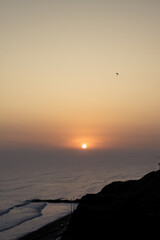Sunset in la Costa Verde (Green Coast) in Lima, Peru - 612415489