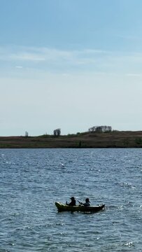 friends on kayak kite surfers on background