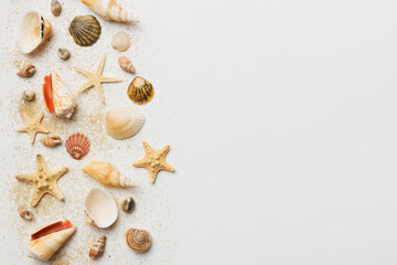 Summer time concept Flat lay composition with beautiful starfish and sea shells on colored table, top view with copy space for text