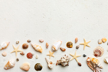 Summer time concept Flat lay composition with beautiful starfish and sea shells on colored table,...
