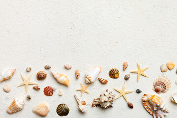 Summer time concept Flat lay composition with beautiful starfish and sea shells on colored table, top view with copy space for text