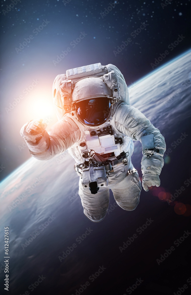 Fototapete Astronaut in outer space over the planet Earth. Spaceman spacewalk. Orbit of Earth in deep space. Elements of this image furnished by NASA