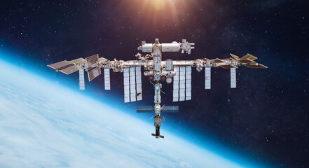 ISS space station on orbit of the Earth planet. Astronauts in space. Elements of this image furnished by NASA