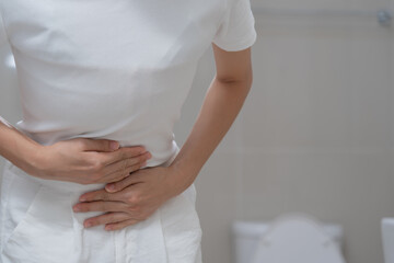 Constipation and diarrhea in bathroom. Hurt man touch belly  stomach ache painful. colon...