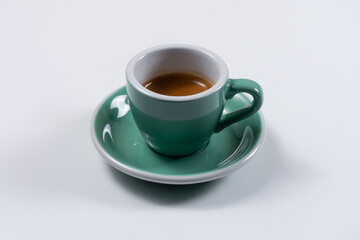 closeup of coffee cup and saucer on white background