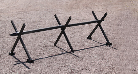 A Three Cross Wooden Temporary Road Barrier.