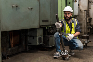 Engineer factory man working with tool in industrial Factory