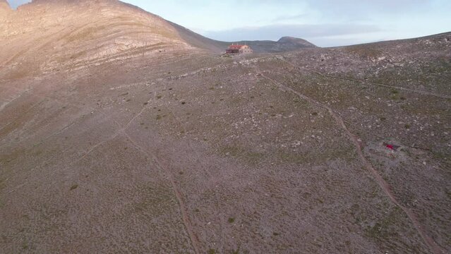 Profitis Ilias peak and Apostolidis refuge on the Muses plateau of Olympus mountain, Greece