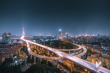 Illuminated modern city at night