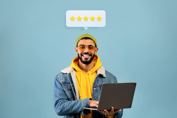 Guy Posing With Laptop And Five Star Feedback, Blue Background