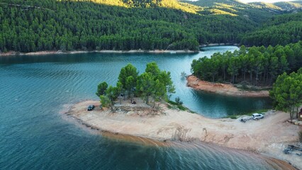 Turquoise dam surrounded by beautiful greenery