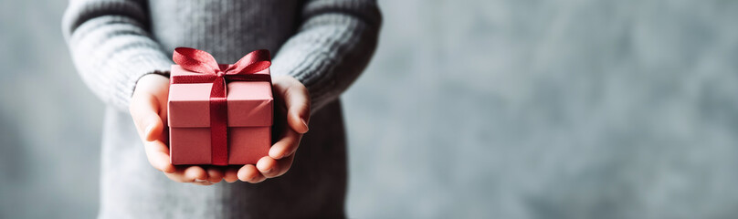 pregnant woman hands holding gift box, Christmas, new year, birthday concept. Banner.Generative ai.