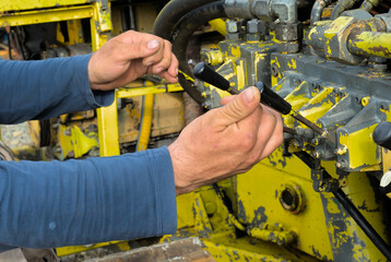 The work of the operator on the control levers of industrial equipment © Mariia Human