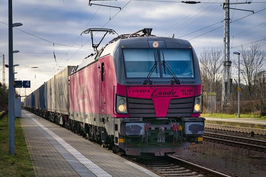 Electric locomotive, Siemens Vectron from Laude carrying a train with containers through Priort