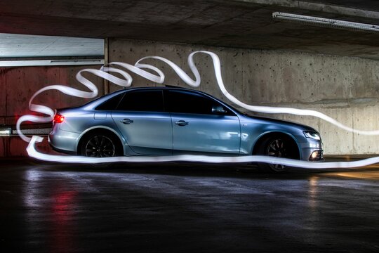 Side view of an Audi S4 in a parking garage with doodles