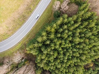 Drone shot of an asphalt road near a forest, cool for background