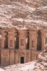 Vertical shot of Ad Deir Monastery in the historic and archaeological city of Petra, Jordan