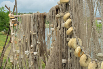 Fishing nets hung on the shore by the sea.