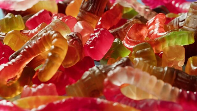 Jelly marmalade cola bottle bear close up, Confiture Bean candy jujube Marmalade bears with cod cannabis close up. 