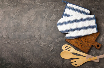 Kitchenware. Oven glove and potholder for hot dishes on a marble textured background. close-up....