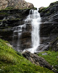 Vertical shot of a splashing cascading waterfall
