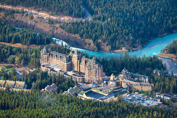Iconic and Historic Fairmont Banff Springs in the town of Banff in the Canada Rockies seen from the top of Sulphur Mountain - obrazy, fototapety, plakaty