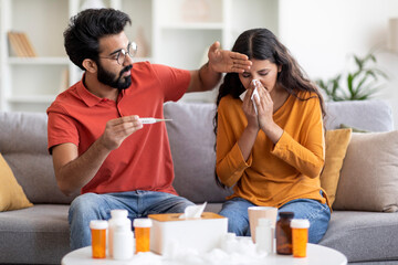Flu And Cold. Indian Man Taking Care Of Ill Wife At Home