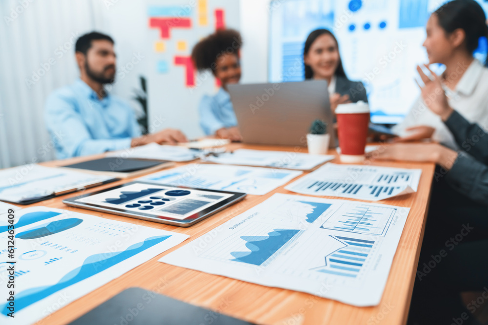 Poster focus financial dashboard paper showing graphs and chart with blurred background of diverse business
