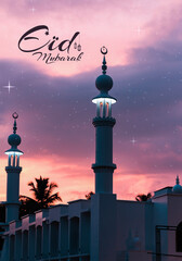 Eid Mubarak greetings image Beautiful mosque minaret view with dramatic sunset sky