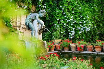Ancient statue in a pool garden