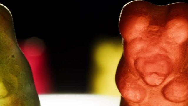 Jelly marmalade cola bottle bear close up, Confiture Bean candy jujube Marmalade bears with cod cannabis close up. 