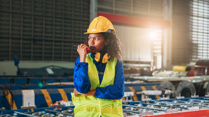 Portrait of Industrial technicians or The foramen will examine and check up on the machinery in the...