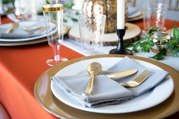 Closeup of utensils and napkins on a table