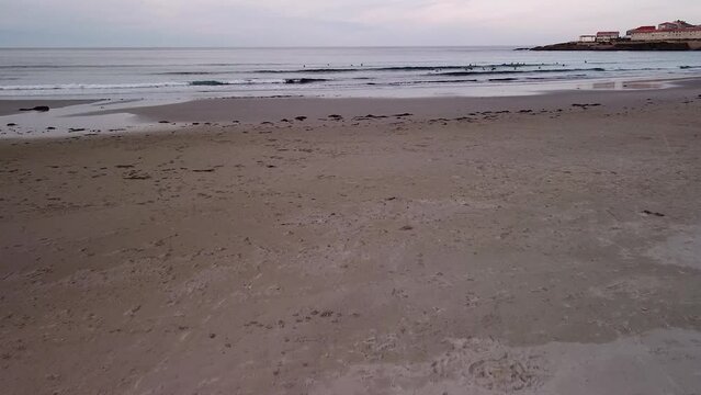 Flying Above Sandy Beach On The Galician Coast In Caion, Spain At Dusk. low aerial