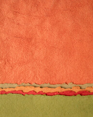 abstract landscape in red, orange and green - collection of Huun papers handmade in Mexico, vertical background