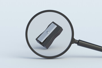 Sharpener behind magnifying glass. 3d render