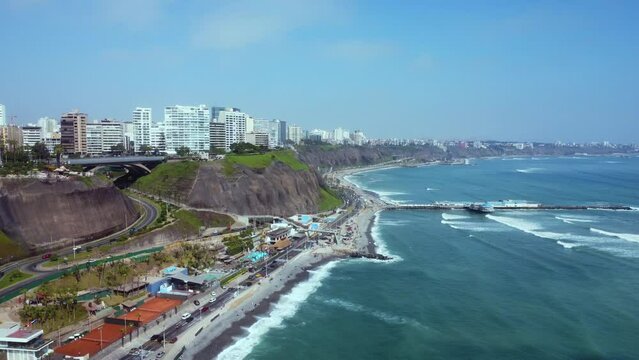 Aerial view of the Miraflores coastline in Lima, Peru - slow motion