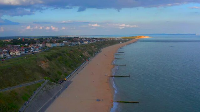 Drone view of narrow docks on a sandy beach