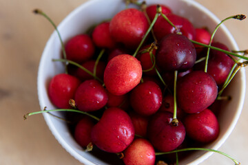 cherries in a bowl close up with blurred background 