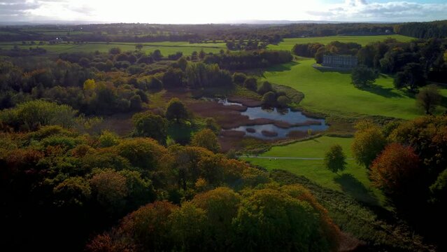 High-angle shot of an old castle in the green park and valley in Limerick, Ireland.